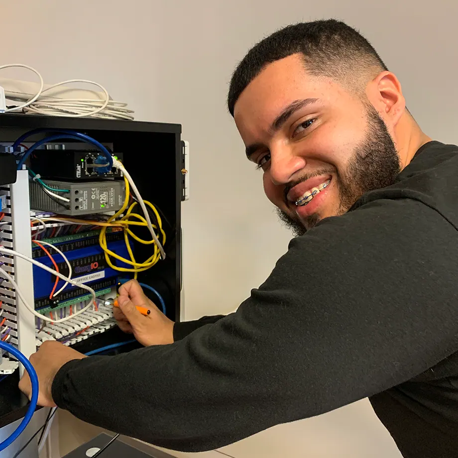 Trainees working on a real BAS panel.